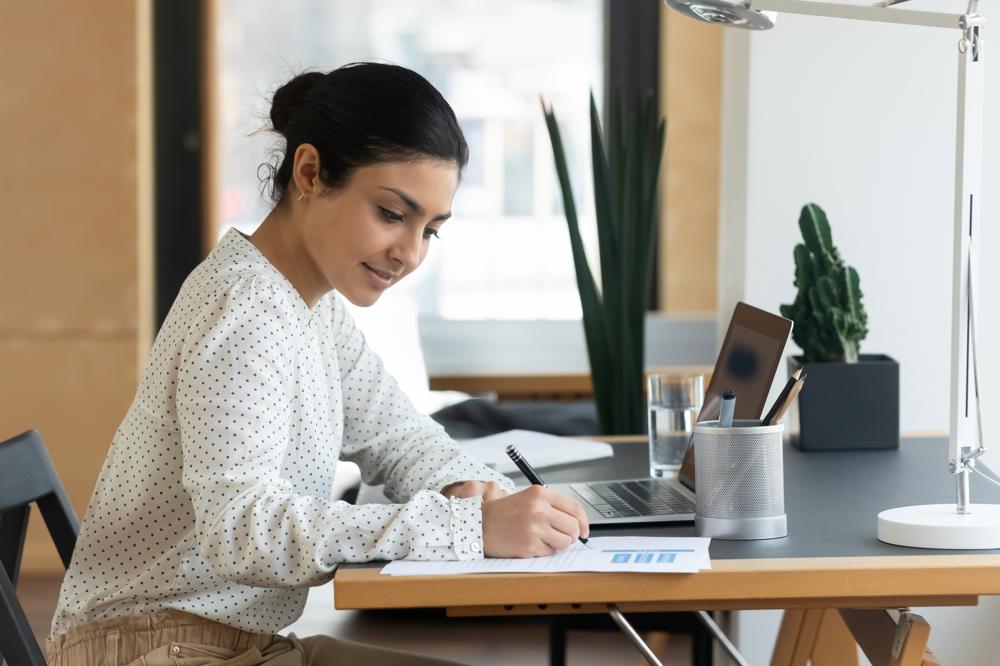 Concentrated Businesswoman Doing Paperwork in the Office